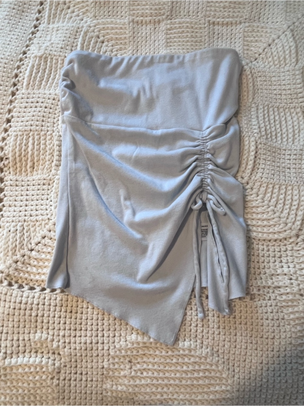 Woman’s light blue tube top